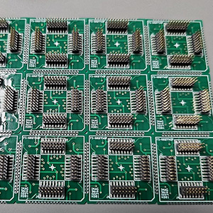 A lot of identical small circuit boards with rows of header connectors on each of the four sides.